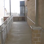 outdoor metal ramp rail on brick wall