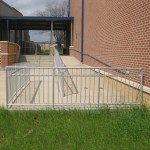 view of metal ramp rail and metal stair rail