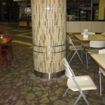 stainless steel ornamental metal work on round column with colorful tile