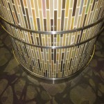 custom metal ornaments attached to tile on round column