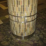 stainless steel ornamental metal work on round column with colorful tile