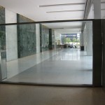 looking through glass wall divider with metal frame
