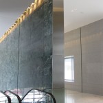 narrow fabricated wall panel with escalator in hess tower