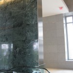 narrow fabricated wall panel with escalator and marble in hess tower