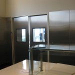 stainless steel walls and doors with windows and glass counter