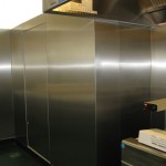 stainless steel wall installed around kitchen fridge unit