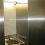 custom fabricated stainless steel on tile wall