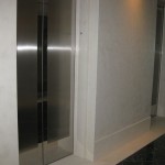 two stainless steel custom elevator doors