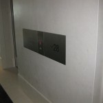 custom elevator floor sign on marble wall