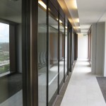metal window casings down a narrow hallway