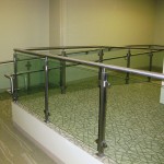 metal handrail near ramp small glass stairway