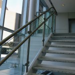 metal and glass hand railing by window