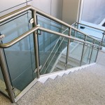 metal and glass handrail on marble stairs for 1225 Louisiana