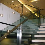 steel handrails on glass stairway