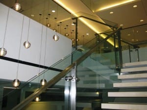 square steel handrails on glass stairway