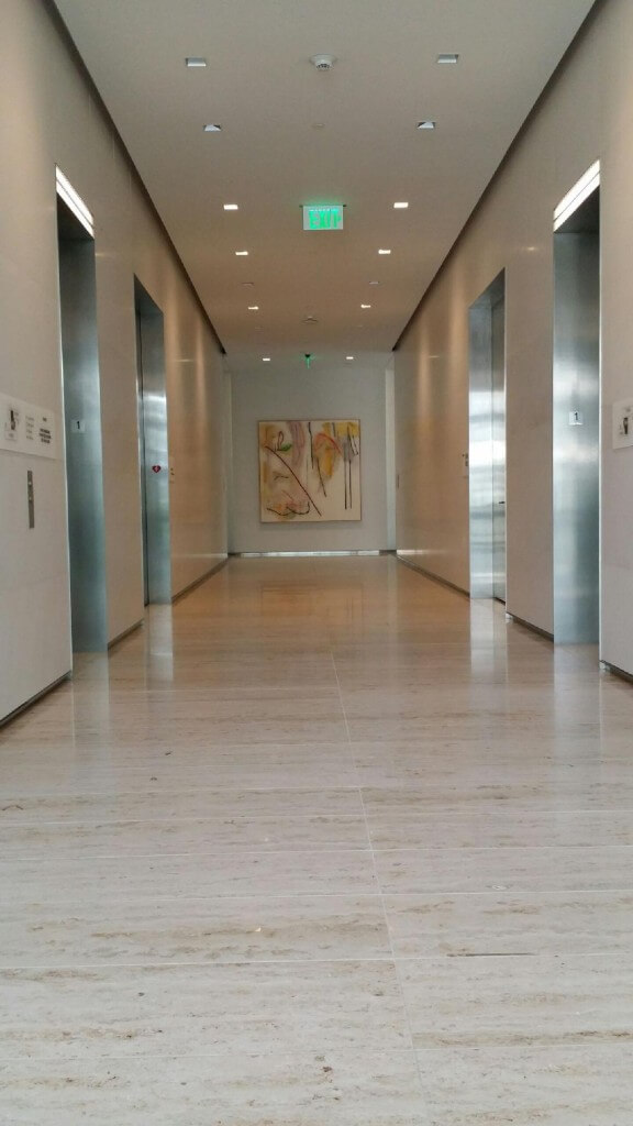 stainless steel baseboards and elevator frames in lobby
