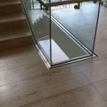 steel handrail cladding on glass stairway
